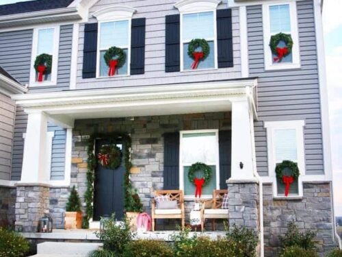 Wreaths and greenery installed on a beautiful house